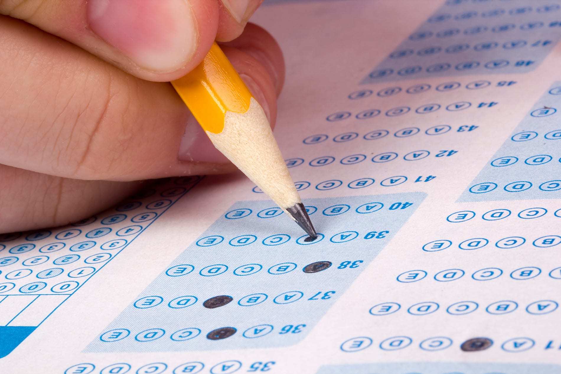 Close-up shot of a pencil being used to fill-out a multiple choice questionnaire - representing the Purple House Clinic's Clinical Psychology Assessment Service.