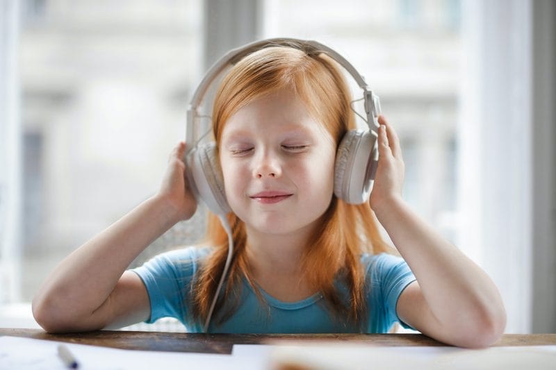 Girl with EMDR headphones, The Purple House Clinic