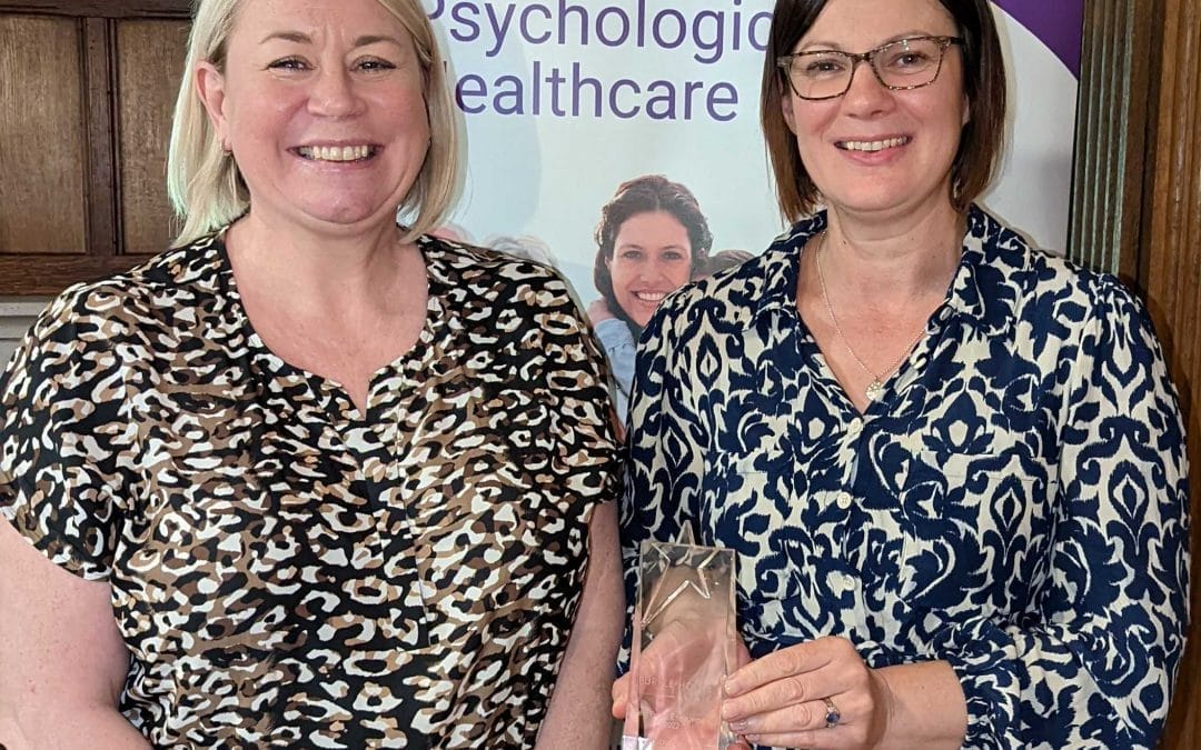 Dr Hayley Poole & Dr Rachel Kemp receiving their award - The Purple House Clinic Rugby Award