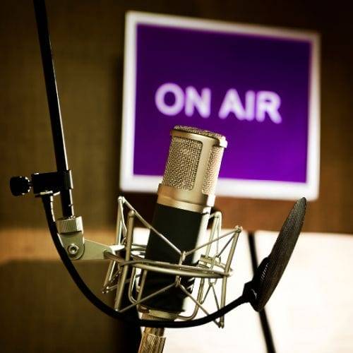 Image of recording studio with microphone and 'on air' message representing the Purple House Clinic's media work in Mental Health & Neurodiversity 